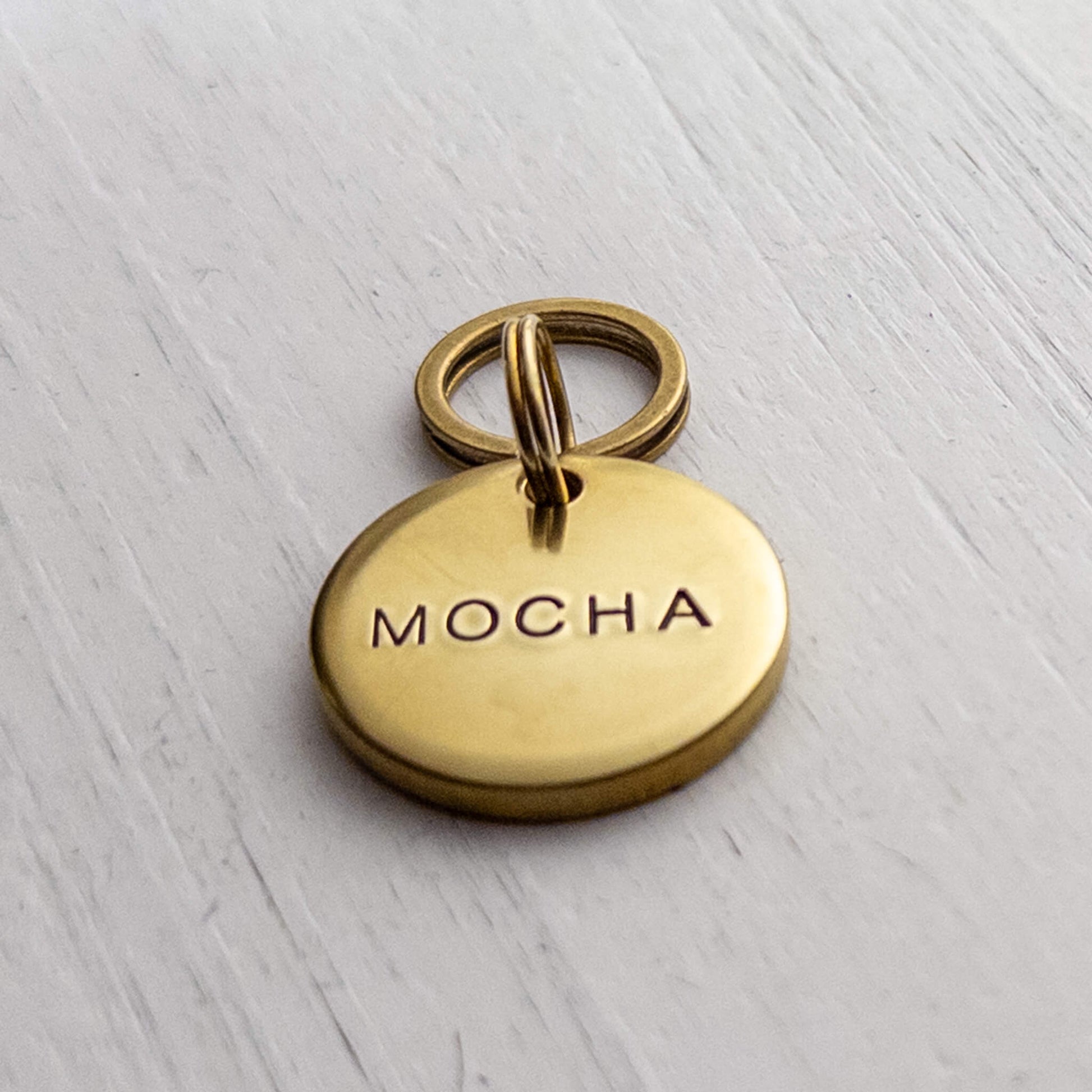 Thick solid brass dog name tag. 