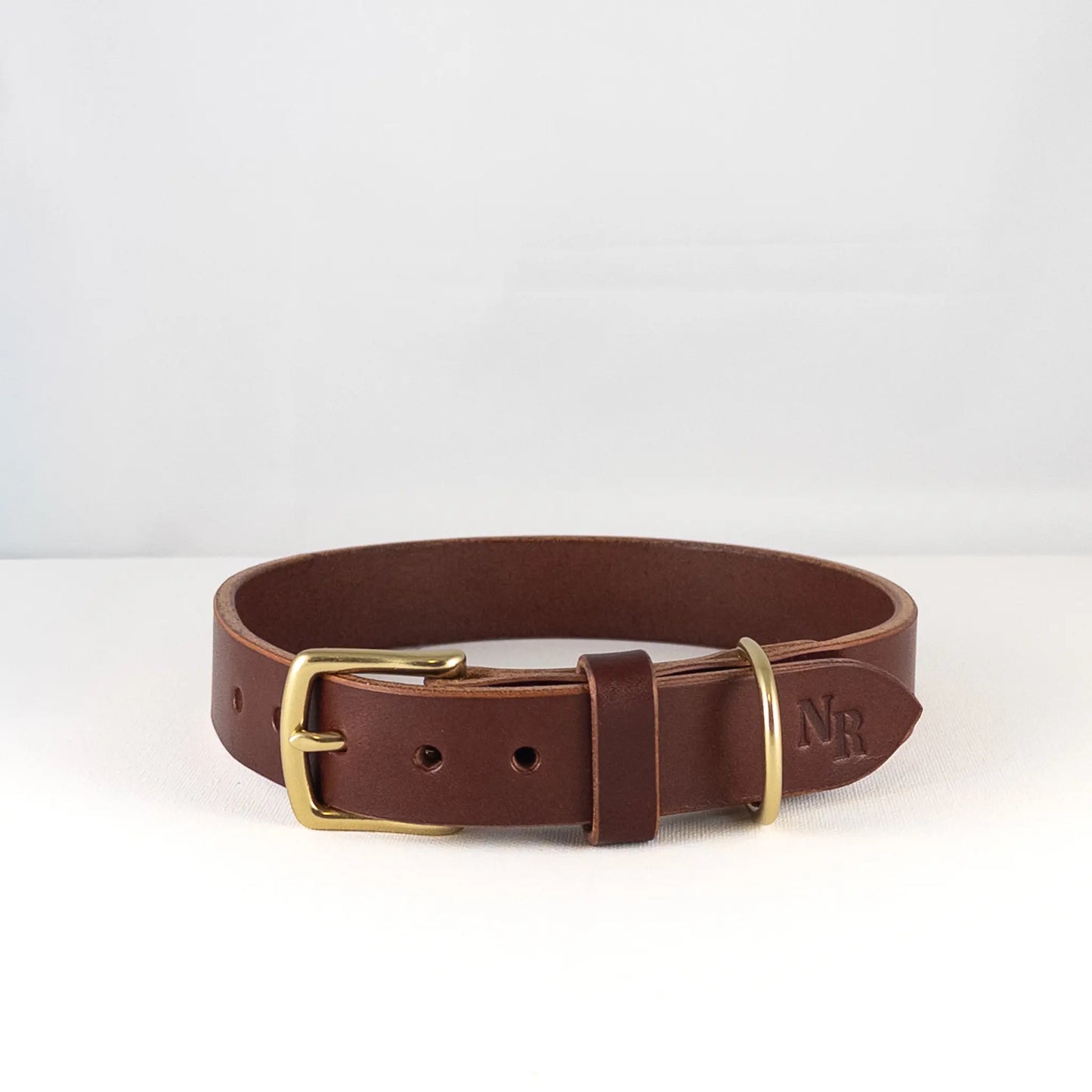 custom leather dog collar in Walnut, front view showing solid brass buckle and D-ring